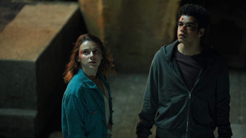 Lyra (Dafne Keen) and Will (Amir Wilson) are bloody after a fight on His Dark Materials