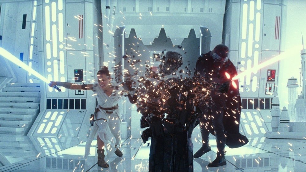 Rey and Kylo Ren smashing Darth Vader's helmet in The Rise of Skywalker