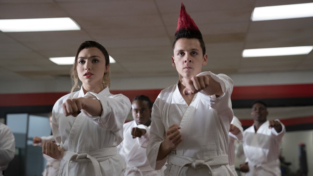 Tory and Hawk punching in Cobra Kai