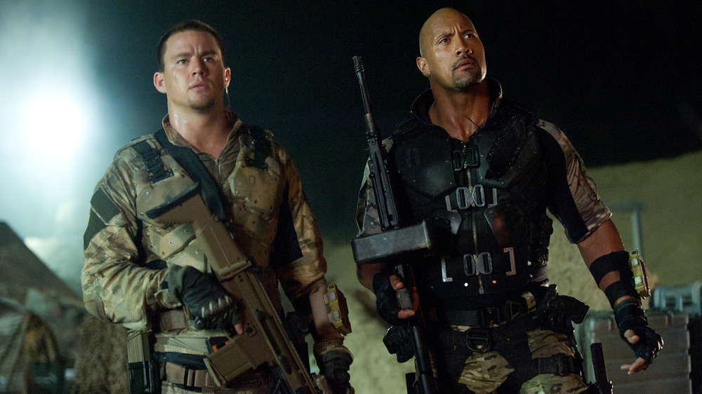 Tatum and Johnson with guns
