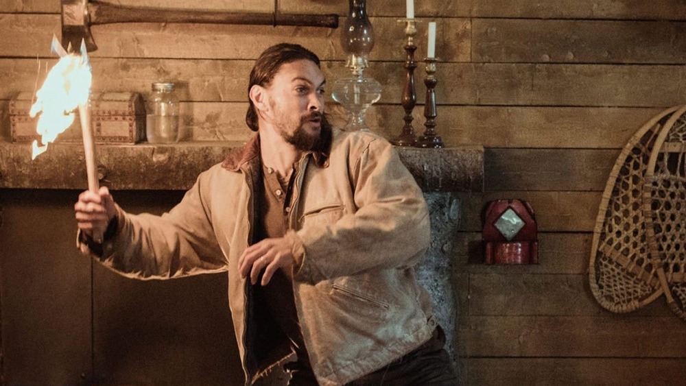 Jason Momoa brandishes a flaming axe
