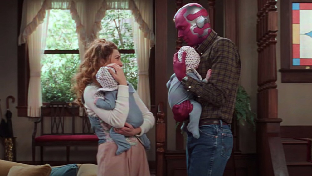 Wanda and Vision holding Billy and Tommy