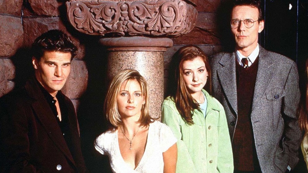 Buffy cast stands near building